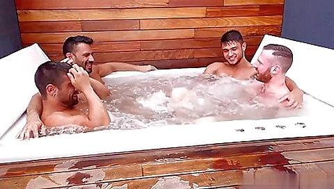 Brunette with tattoos in the bathroom plays with guys' balls