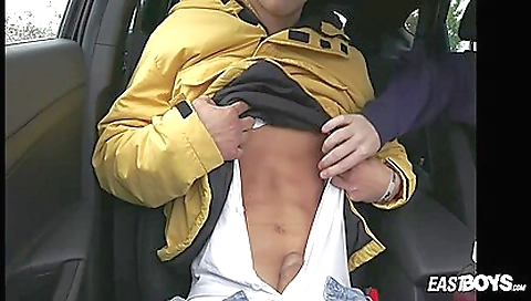 Busty brunette with a sexy face has a hot sex in a car
