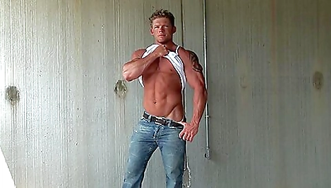 Big ass guy with a tattooed face is filming in the outdoors