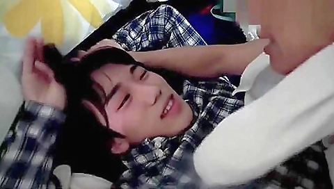 Asian babe takes young sweet twink down and takes his dick