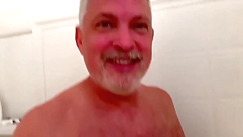 One young man is in the kitchen and has sex with two females